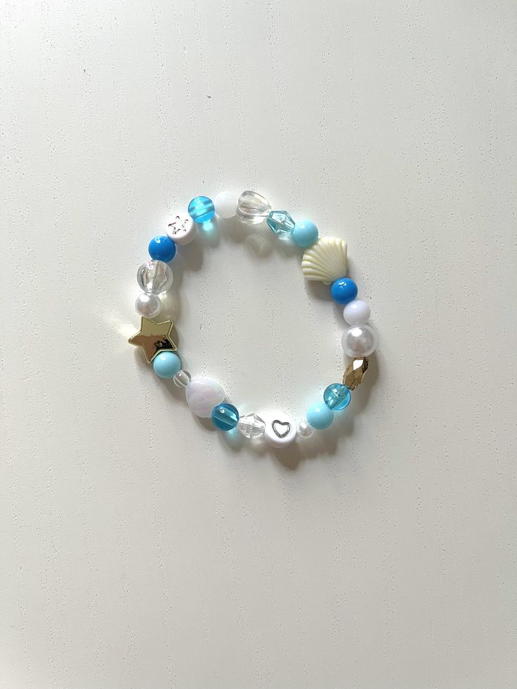 ️ MERMAID TURQUOISE MODEL ️ This fun and colorful bracelet will match any outfit and add a hint of joy to your day. A great gift to give yourself or your friends 🫶 Each product is unique, some beads may vary to guarantee the uniqueness of your necklace. 👀 PRODUCT DETAILS: * Resin beads * Elastic thread * Bracelet circumference: 16 cm 💌 SENDING: FREE DELIVERY Your necklace will be placed in a cotton bag made from fabric scraps then packaged in a small 100% recycled, recyclable or reusable card Playful Turquoise Beaded Bracelets With Colorful Beads, Cute Blue Beaded Bracelets With Heart Beads, Ocean-inspired Blue Beaded Bracelets, Summer Heart Beads Bracelet Jewelry, Playful Turquoise Beaded Bracelets, Playful Turquoise Beaded Bracelet, Playful Blue Beaded Bracelet, Playful Beaded Turquoise Bracelets, Playful Blue Jewelry For The Beach