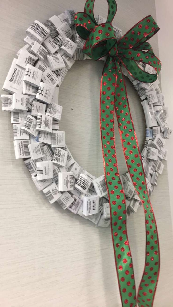 a christmas wreath made out of dollar bills