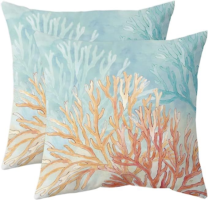 two decorative pillows with corals on them