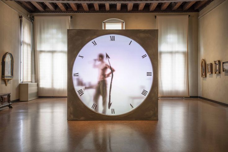 a large clock in the middle of a room