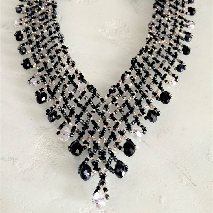 Artisan Czech Glass Bead 20" Long Fashion Statement "V" Style Necklace Black, Crystal Glass Beads Necklace In Shimmering Beads & Iridescent Silver Beads Easy To Open/Close Magnetic Clasp One Of A Kind Necklace Handcrafted/No Two Are Exactly Alike Handmade In Guatemala Using Artisan Crafted Czech Glass Beads. Principles Of Fair Trade Are Upheld. Please Visit Our Posh Closet To See The Entire Collection Of Necklaces, Earrings & Bracelets Black Crystal Beaded Necklaces For Party, Black Crystal Beaded Party Necklace, Crystal Necklace With Black Beads As A Gift, Silver Faceted Beads Evening Jewelry, Black Crystal Beaded Necklaces For Gift, Black Crystal Beaded Necklace For Gift, Elegant Crystal Beaded Necklaces With Black Beads, Black Crystal Necklaces For Party, Party Crystal Necklaces With Black Round Beads