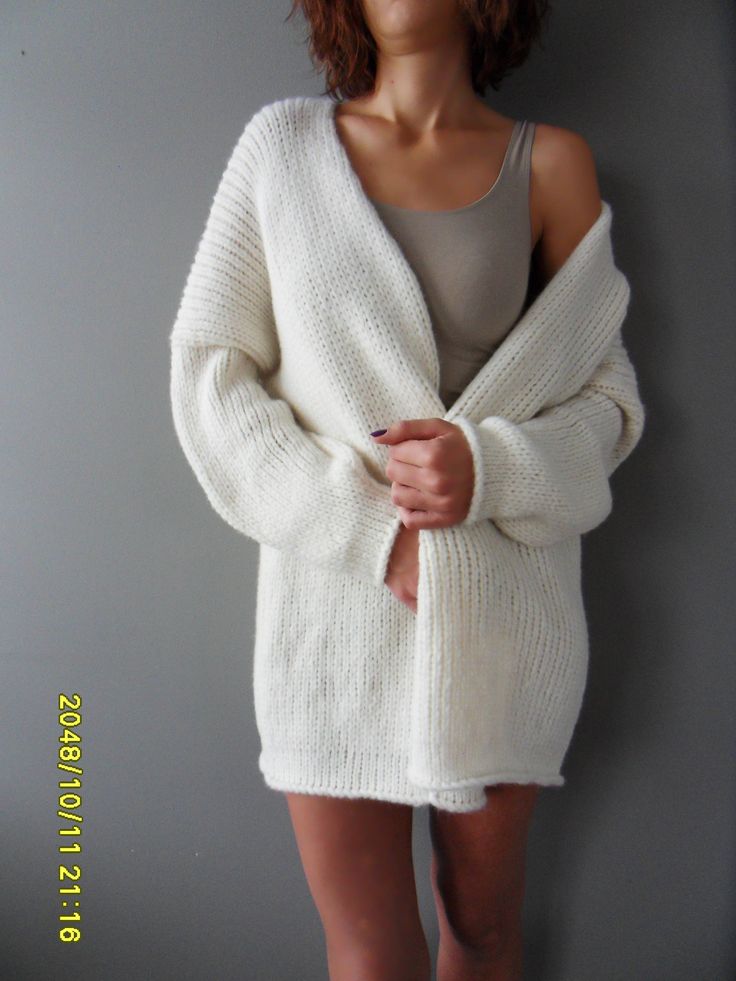 "Luxury, amazingly soft, oversized alpaca knit sweater cardigan . The pattern has relaxed fit with dropped shoulders. Color is off white. For colors available in pearl /light grey, black/charcoal, brown, crem/wheat, blue /green, burgundy, violet and pink click here https://www.etsy.com/ca/listing/187868895/alpaca-chunky-knit-woman-cardigan?ref=related-1 A new and exciting \"blow yarn\" made from soft 72% Baby Alpaca and cozy Merino wool. Its construction is unique, based on the newest yarn techn White Chunky Knit Sweater Coat For Winter, Cozy Long Chunky Knit Sweater, White Oversized Long Sweater Coat, Oversized White Long Sweater Coat, White Long Oversized Sweater Coat, Cozy Hand-knitted Winter White Sweater, Oversized Hand-knitted Long Sweater, Cozy Hand Knitted Winter White Sweater, Cozy Oversized Knitted Cardigan