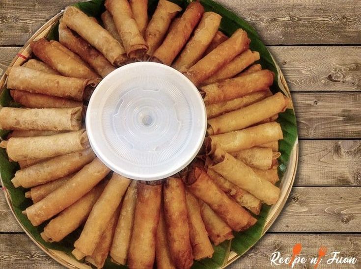 a platter filled with food on top of a wooden table