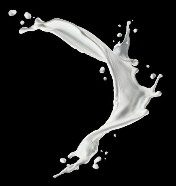 milk splashing into the air on a black background