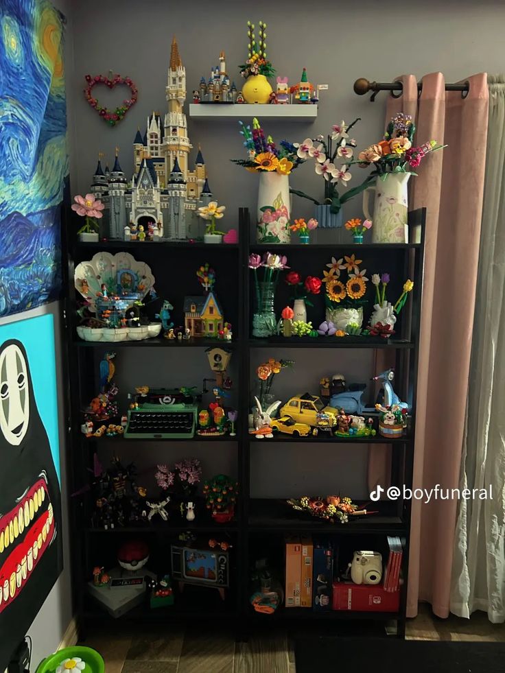 a room filled with lots of toys and other items on shelves in front of curtains