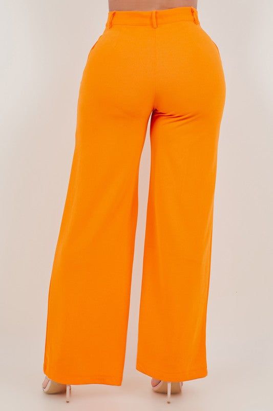 Stand out in style with these vibrant orange pants that are perfect for any occasion. Made from high-quality fabric, these pants offer both comfort and style. Feature 1: High waist design for a flattering fit Feature 2: Front zipper and pockets for added convenience Feature 3: Wide leg for a trendy look Feature 4: Stretchable material for ease of movement Model is wearing a size Large Casual Orange Bottoms, Orange Solid Bottoms For Spring, Orange Solid Color Bottoms For Spring, Orange Bottoms For Summer, Orange Solid Color Bottoms For Summer, Orange High-waisted Wide Leg Pants For Fall, High Waist Orange Bottoms, High-waisted Wide Leg Orange Pants For Fall, Orange Wide-leg Pants For Fall