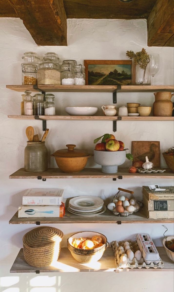 the shelves are filled with many different types of food and items to cook in them