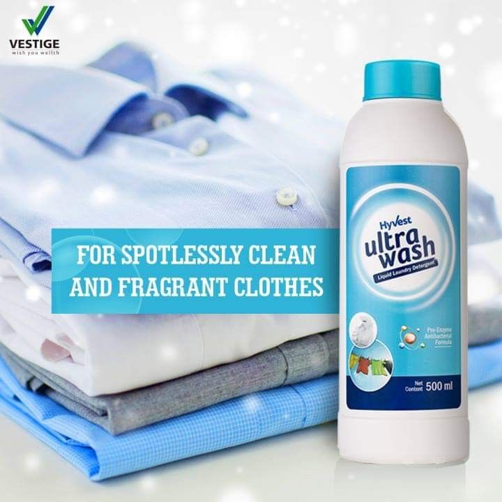 a bottle of ultra wash sits next to folded shirts on a white surface with snow flakes in the background