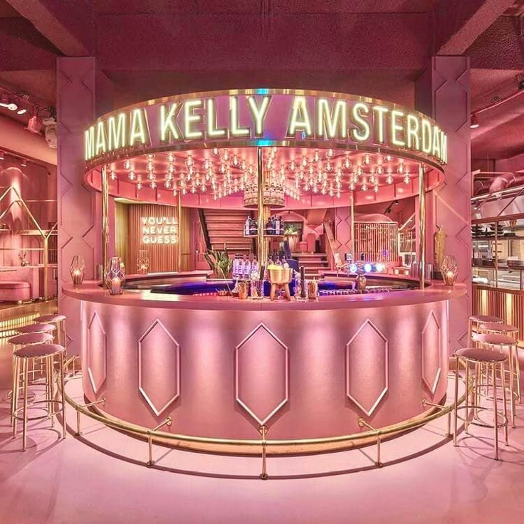 the inside of a restaurant with pink lighting