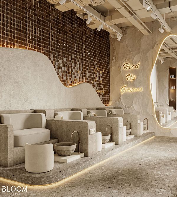 the interior of a modern restaurant with stone walls and white furniture, lighted by neon lights