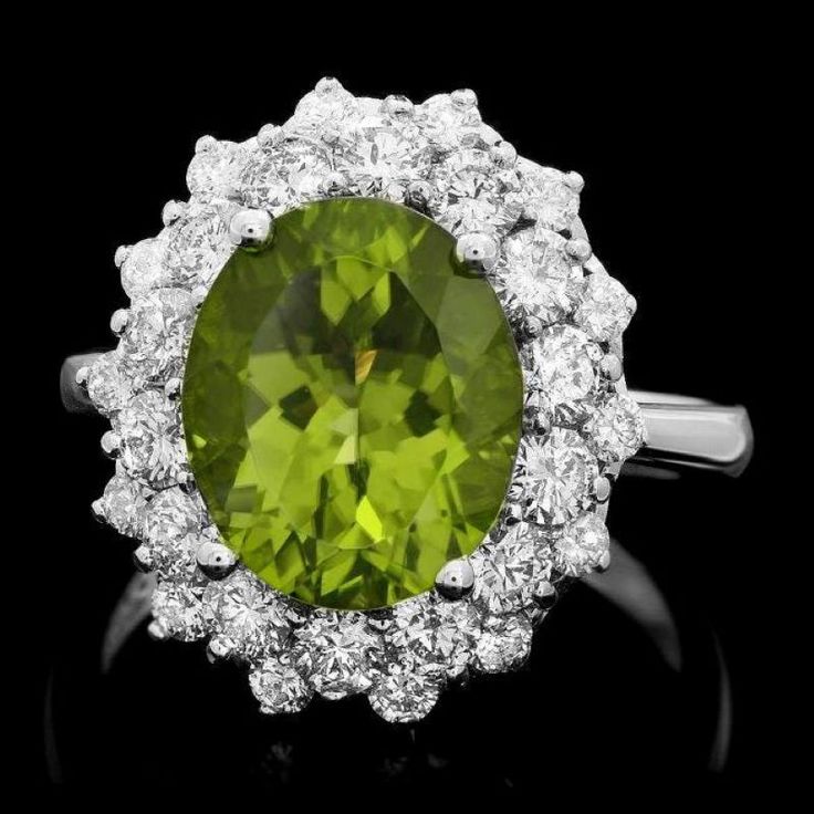 6.30 Carats Natural Very Nice Looking Peridot and Diamond 14K Solid White Gold Ring Total Natural Oval Cut Peridot Weight is: Approx. 4.80 Carats Peridot Measures: Approx. 10 x 12mm Natural Round Diamonds Weight: Approx. 1.50 Carats (color G-H / Clarity SI1-SI2) Ring total weight: Approx. 6.9 grams Disclaimer: all weights, measurements and colors are approximate and may vary slightly from the listed dimensions or as seen in the image. All pictures are magnified to show the smallest of details. P Green Multi-stone Diamond Ring For Formal Occasions, Formal Green Multi-stone Diamond Ring, Fine Jewelry Peridot Gemstones For Formal Occasions, Luxury Peridot Ring For Formal Occasions, Luxury Peridot Jewelry For Formal Occasions, Luxury Oval Peridot Rings, Formal Peridot Diamond Ring With Center Stone, Oval Peridot Diamond Ring For Formal Occasions, Formal Peridot Diamond Ring With Prong Setting