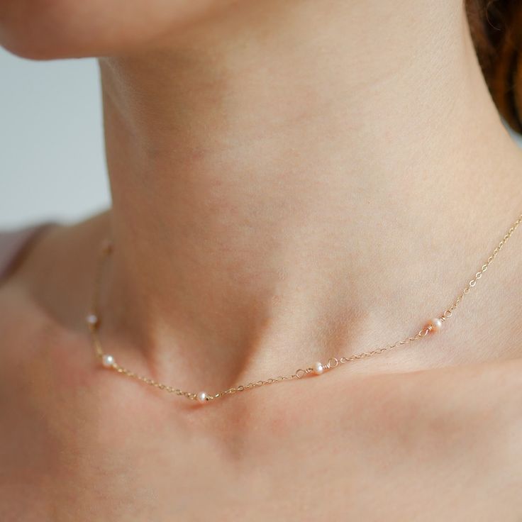 The Tinsel Necklace, one of our best-sellers, is a delicate piece perfect for the feminine girl next door. Featuring natural pink cultured freshwater pearls, this necklace adds a refined touch whether worn solo or stacked. Pearls, known to symbolise wisdom and abundance, make this elegant necklace both stylish and meaningful—a must-have for any jewellery collection. 14k gold-filled (hypoallergenic and tarnish-resistant) 2. 5 - 3 mm cultured freshwater pearls (Pink) Feminine Girl, Stocking Fillers For Him, Stocking Fillers For Her, Forever Jewelry, Elegant Necklace, Demi Fine Jewelry, Freshwater Cultured Pearls, Elegant Necklaces, Cuff Earrings