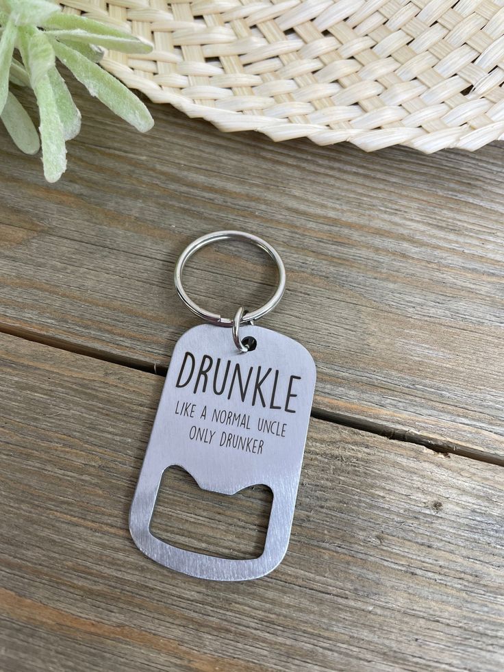 a bottle opener keychain that says drunkle like a normal single only drinker