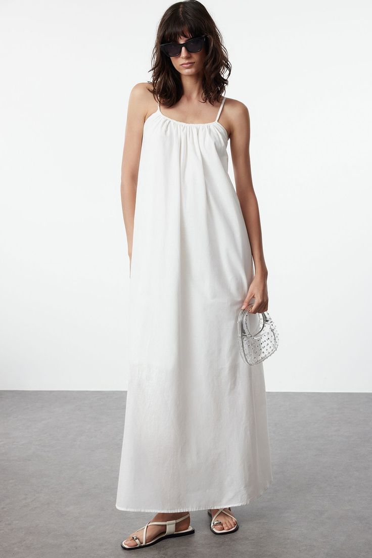 white maxi sundress Summer Maxi Length Sundress For Daywear, Summer Maxi Sundress For Daywear, Casual Beach Slip Dress With Spaghetti Straps, Summer Daywear Flowy Maxi Dress, Summer Flowy Maxi Dress For Daywear, Flowy Maxi Dress For Summer Daywear, Daywear Maxi Dress With Knotted Spaghetti Straps, Flowy Maxi Dress For Daytime Summer, Summer Style Maxi Dress With Smocked Back