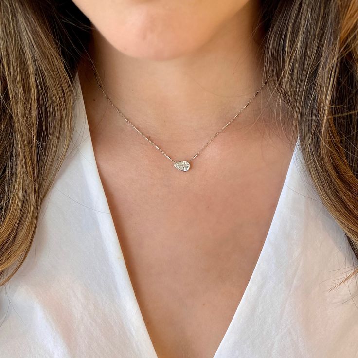 Who doesn’t love a pear? (A pear-shaped diamond, that is). At a stunning 1.06cts, this pendant is the only piece you’ll need to make an elegant statement. - 1.06cts, I color & I2 in clarity Available in white, yellow or rose gold. This necklace can be made with customer stone. Please allow 2-3 weeks for delivery if item is not in stock. Item No. 210000008172 Pear Shaped Diamond Necklace, Diamond Engagement Rings Cushion, Cushion Halo Engagement Ring, Diamond Bar Necklace, Round Halo Engagement Rings, Oval Diamond Engagement, Oval Diamond Engagement Ring, Engagement Ring Diamond Cut, Engagement Rings Round