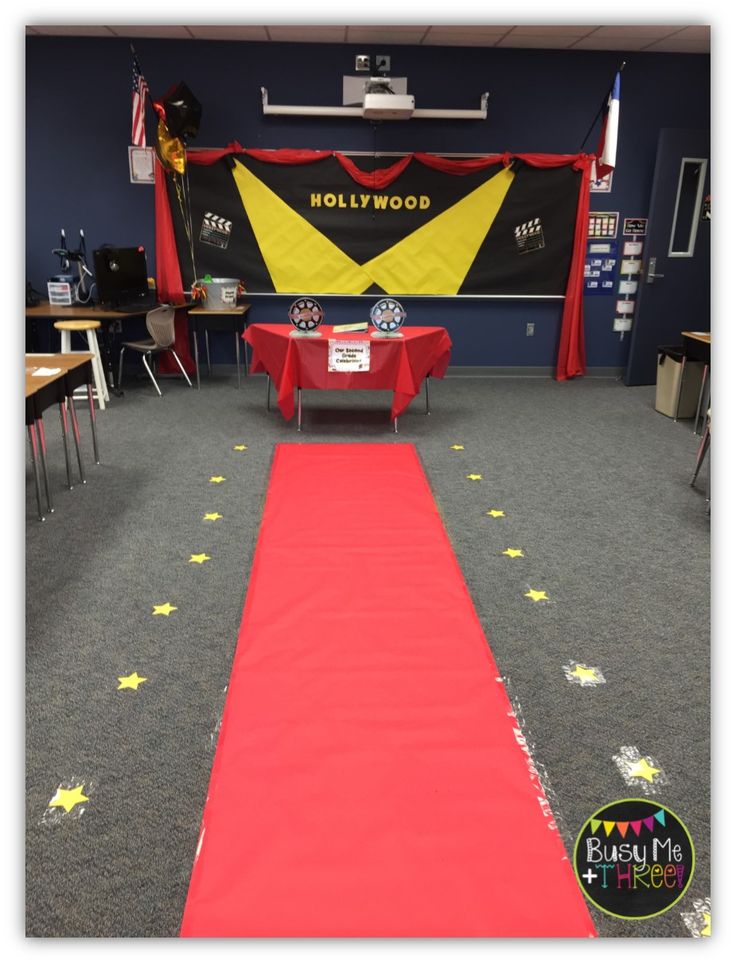 a red carpeted aisle with yellow stars on it