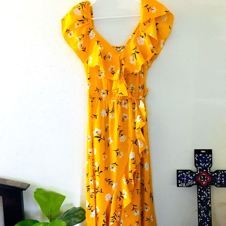 This Very Light Summer Dress Is Beautiful,Comfy And Flowery. Never Wore With Tag Yellow Midi Floral Dress For Vacation, Yellow Floral Midi Dress For Vacation, Yellow Floral Sundress For The Beach, Yellow Floral Sundress For Beach, Yellow Floral Dress With Ruffles For Garden Party, Yellow Floral Print Midi Sundress, Yellow Floral Sundress For Spring, Yellow Floral Short Sleeve Dress For Beach, Yellow Floral Sundress For Garden Party