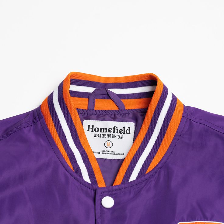 For this vintage-inspired bomber jacket, we paired this classic, strutting Clemson Tiger in his Tiger Paw sweater with an equally iconic “Clemson” script. A Clemson fan needs no introduction, and you especially won’t need one in this bold, retro nod to the Tigers. Brought to you in partnership with College Vault. Collegiate Style Track Jacket For Fall Sports Events, Team-colored Outerwear For Game Day In Fall, Collegiate Track Jacket For Game Day In Fall, Collegiate Track Jacket For Game Day, Collegiate Style Track Jacket For Game Day In Fall, Collegiate Style Track Jacket For Game Day, Collegiate Outerwear For Baseball Season Game Day, Varsity Track Jacket For Game Day In Fall, Throwback Track Jacket For College Sports Season