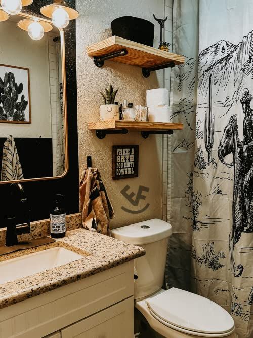 a bathroom with a toilet, sink and shower curtain