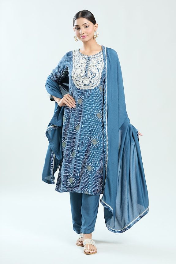 Dark blue straight kurta with floral bandhani print and thread embroidered yoke. Paired with coordinating pant and dupatta. - Aza Fashions Indigo Straight Kurta Sets With Dabka Detail, Indigo Straight Kurta Set With Dabka, Indigo Dabka Straight Kurta Sets, Blue Semi-stitched Unstitched Suit In Mulmul, Indigo Sets With Dupatta For Navratri, Indigo Navratri Set With Dupatta, Indigo Straight Kurta Designer Set, Blue Mulmul Palazzo Set With Straight Kurta, Blue Mulmul Straight Kurta Set