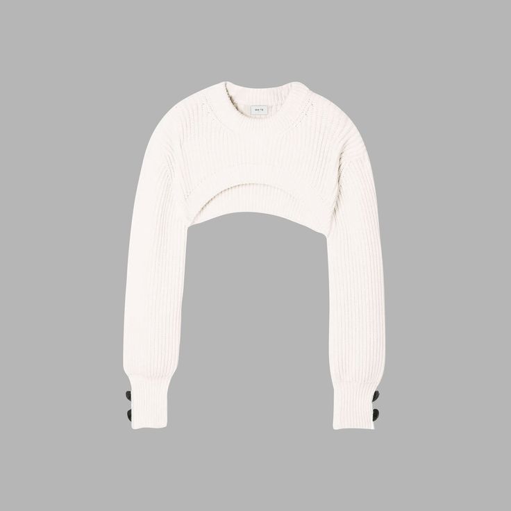 The 'Whte Cropped Cotton Sweater' is perfect for a casual, laidback look. Made from luxurious ivory cotton, all our sweaters are super soft to the touch and perfect for everyday wear. Fits regular size. Trendy White Cropped Sweater With Ribbed Cuffs, Fitted Off White Casual Sweater, Fitted Off-white Casual Sweater, Fitted Winter White Crew Neck Sweater, Fitted Crew Neck Sweater In Winter White, Chic White Sweater With Ribbed Cuffs, White Casual Stretch Sweater, Casual White Stretch Sweater, Off White Tops For Fall Layering