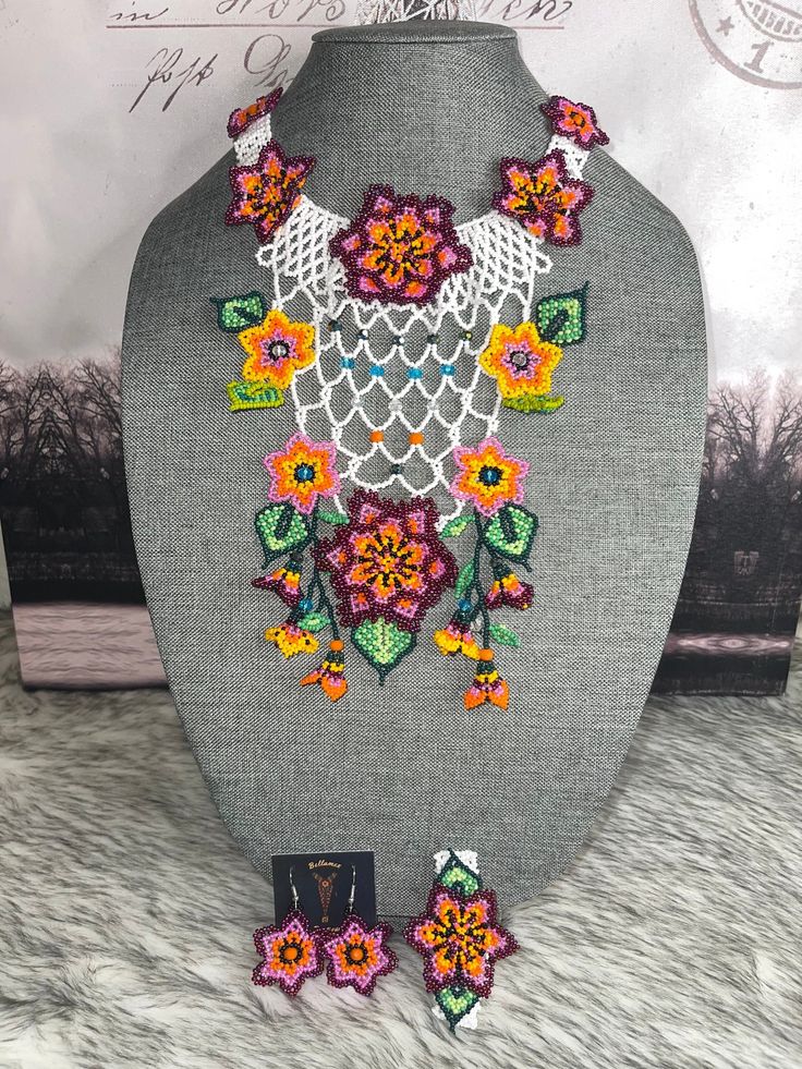 the necklace and earrings are on display