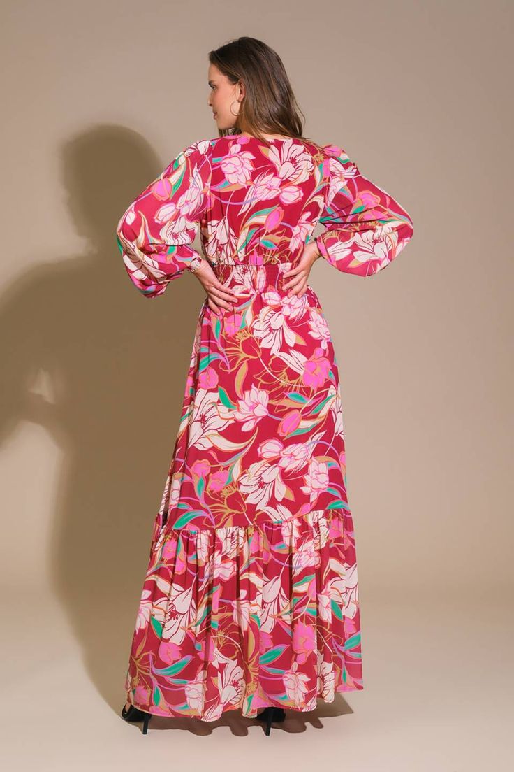 A printed woven maxi dress featuring V neckline, long sleeve with smocked cuff, smocked waist band and ruffled hemline Details: Self : 100% PolyesterLining : 100% Polyester Size & Fit - Model is 5`9" And Wearing Size Small- Measurements Taken From Size Small- Approx. Length: 60" V-neck Maxi Dress With Elastic Sleeves For Daywear, Pink Maxi Dress With Elastic Waistband For Spring, Pink Maxi Dress With Elastic Waistband For Vacation, Chic V-neck Maxi Dress With Smocked Cuffs, Pink Maxi Dress With Elastic Waistband For Beach, Casual Pink Maxi Dress With Elastic Waistband, V-neck Maxi Dress With Smocked Cuffs, Fall Maxi Dress With Elastic Waistband And Long Sleeves, Fall Long Sleeve Maxi Dress With Elastic Waistband