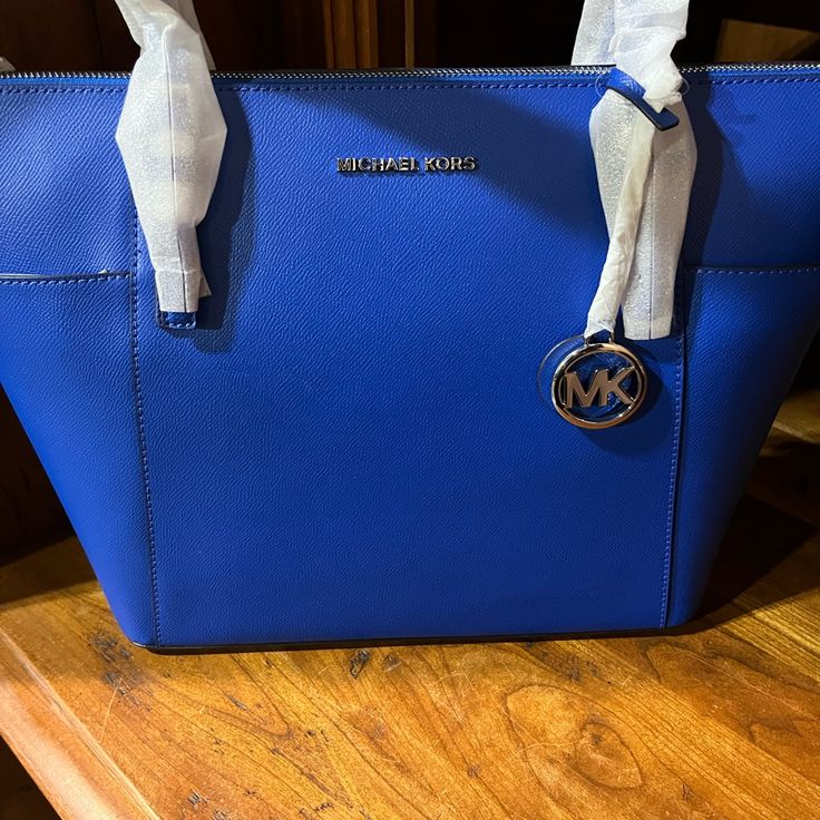 Blue Purse Hand Bag Luxury Blue Bag With Zipper Closure, Blue Satchel Shoulder Bag With Branded Hardware, Blue Shoulder Bag For Travel With Dust Bag, Blue Satchel Bag With Branded Hardware, Blue Bags With Zipper Closure For Errands, Blue Shoulder Bag For Shopping With Dust Bag, Elegant Michael Kors Blue Bag, Elegant Blue Michael Kors Bag, Blue Shoulder Bag With Zipper For Shopping