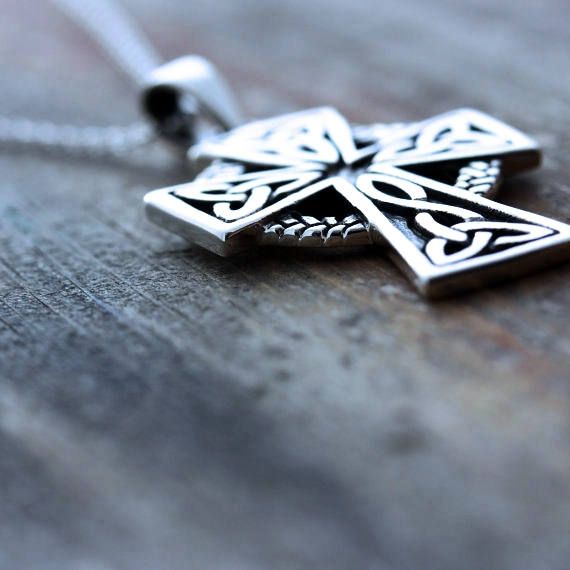 "This sterling silver pendant is just Amazing!! this Celtic Cross necklace is not just beautiful in design but also in meanings, this pendant is a symbol which emphasizes the endlessness of love of God shown through the sacrifice of Jesus on the Cross. The Celtic knot at the bottom of the cross represents friendship, affection, that cannot be broken. The trinity design on the arm of the Cross symbolize God's love around the Holy Trinity. Also It represent the three promises of a relationship suc Symbolic Silver Jewelry With Laser Engraving, Spiritual Silver Necklace With Engraving Option, Symbolic Silver Laser Engraved Jewelry, Symbolic Laser Engraved Silver Jewelry, Symbolic Silver Necklace With Laser Engraving, Laser Engraved Sterling Silver Necklace, Laser Engraved Sterling Silver Jewelry, Silver Etched Cross Pendant Necklace, Silver Etched Cross Necklace