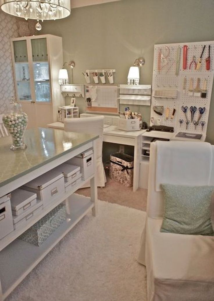 a room filled with lots of white furniture and decor on top of carpeted flooring