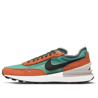 The Nike Waffle One SE 'Pro Green Rust Oxide' is a stylish sneaker that stands out with its unique Pro Green, Rust Oxide, Rush Orange and Black colorway. It features a transparent mesh upper, suede overlays and a leather Swoosh. The signature plastic TPU heel clip and black waffle rubber outsole complete the design. This sneaker is perfect for everyday activities and is sure to make a statement. The Pro Green Rust Oxide colorway is inspired by the classic Waffle One series, making it a must-have for any sneaker enthusiast. (SNKR/Men's/Casual/Low Top/Leather/Non-Slip/Shock-absorbing) Retro Green Custom Sneakers With Boost Midsole, Retro Green Sneakers With Boost Midsole, Retro Nike Running Shoes With Boost Midsole, Modern Low-top Basketball Shoes With Rubber Waffle Outsoles, Urban Green Sneakers With Rubber Waffle Outsoles, Nike Green Retro Sneakers, Retro Green Nike Sneakers, Modern Orange Sneakers With Translucent Outsole, Nike Custom Green Sneakers With Rubber Waffle Outsoles