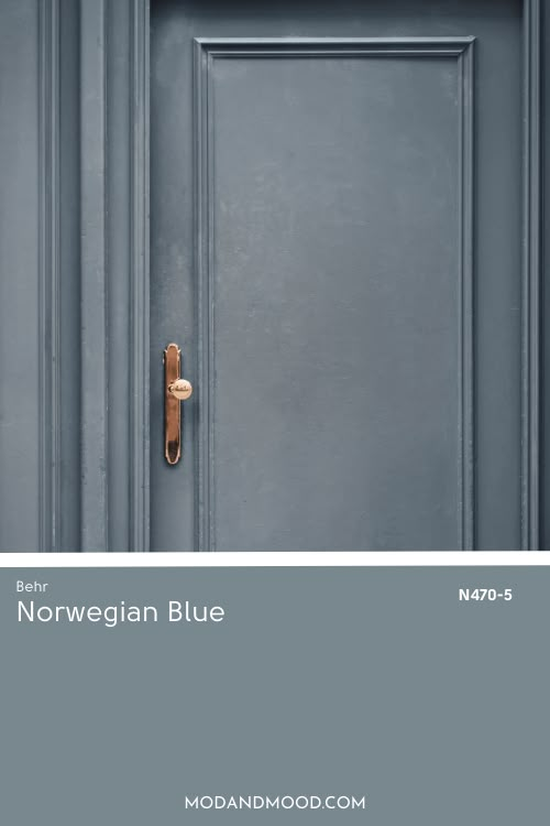 the front door is painted blue and has a handle on it