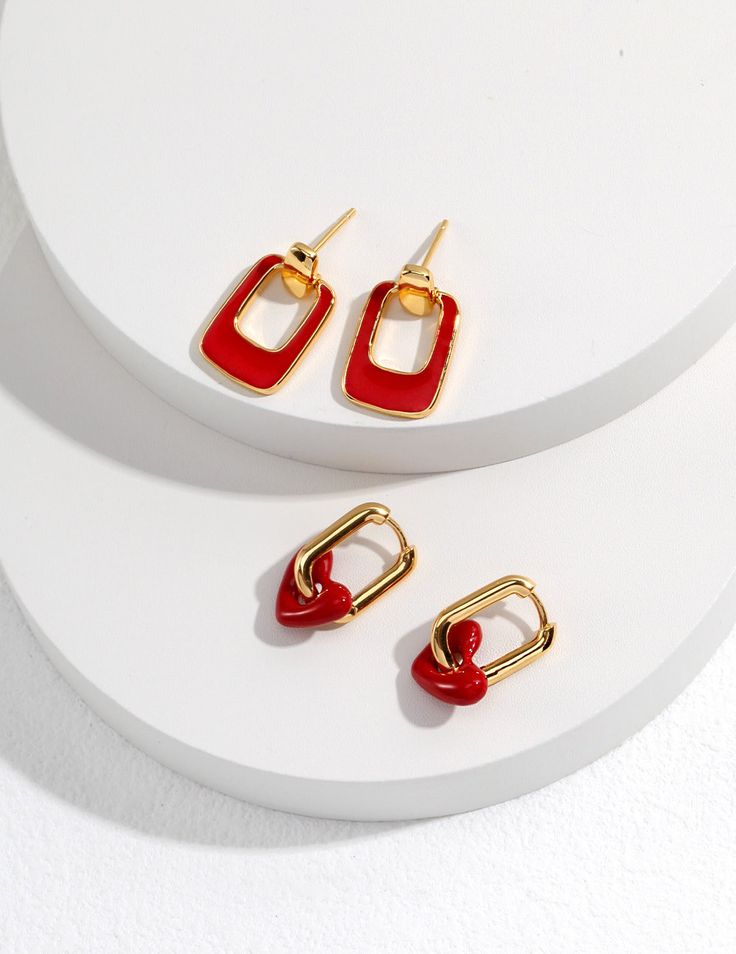 collection of minimalist gold earrings with a bold red color drip glaze Trendy Jewelry With Matching Rectangular Earrings, Trendy Rectangular Jewelry With Matching Earrings, Modern Rectangular Pendant Earrings As Gift, Modern Rectangular Pierced Earrings, Rectangular Metal Earrings For Gift, Rectangular Metal Earrings For Gifts, Heart Earrings Aesthetic, Minimalist Gold Earrings, Red Drip