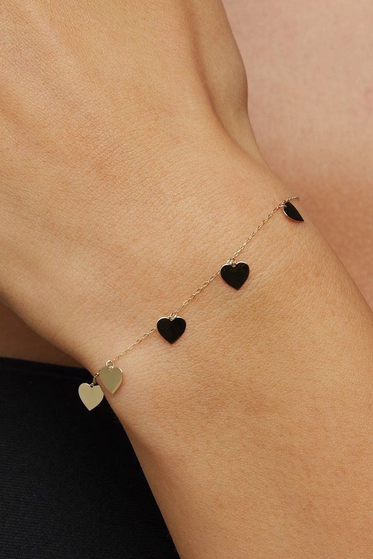 High quality Heart Bracelet for everyday wearing. 14k Multiple Heart Bracelet, Gold Heart Bracelet Women 14k, Gold Heart Bracelet Women 14k Diamond, Best gifts for Mom *60 Day Return Policy We are committed to your satisfaction. Engraved or non-engraved; if you are not happy with your choice, return it in original condition within 60 days. ITEM DETAILS Material: Heart Bracelet is 14K Solid GOLD ( not filled or plated).  * Gold Bracelet Chain Length: 19cm  * Chain Width: 0,65mm * Finish: 14K Yell Fine Jewelry Heart Bracelet With Charm For Anniversary, Fine Jewelry Heart Charm Bracelet For Anniversary, Tarnish Resistant Heart Bracelet For Anniversary, Heart-shaped Jubilee Bracelet Jewelry As Gift, Tarnish-resistant Heart Bracelet For Anniversary, Fine Jewelry Heart Bracelet As Gift, Valentine's Day Jubilee Heart Bracelet, Elegant Black Bracelets With Heart Charm, Polished Finish Bracelet For Anniversary On Valentine's Day