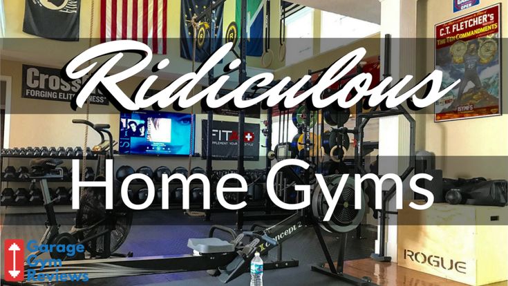 the inside of a home gym with an american flag hanging on the wall and other equipment