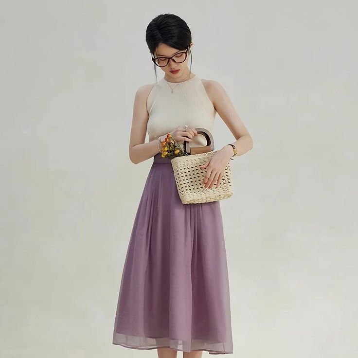 Discover Timeless Elegance Step into style with our Elegant High-Waist A-Line Mid-Calf Skirt, designed for the modern office lady who values sophistication and comfort. Crafted with a blend of high-quality nylon and polyester, this skirt epitomizes effortless elegance and durable wear. Its solid color and clean lines ensure it pairs seamlessly with both formal and casual tops, making it a versatile addition to your wardrobe. Features That Stand Out Empire Waistline: Enhances your silhouette, creating a flattering figure. Quality Fabric: Made with 51.1% Nylon and 48.9% Polyester, offering durability and comfort. Non-Stretch Broadcloth: Keeps its shape while offering a structured, polished look. Mid-Calf Length: Perfect for both office settings and social gatherings. Size chart Size Side Len Elegant Flared Skirt For Brunch, Elegant High Waist Pleated Skirt For Summer, Elegant Pleated Skirt For Brunch, Versatile Midi Skirt For Summer, Versatile Pleated Summer Skirt, Elegant Purple Maxi Skirt, Versatile High Waist Spring Skirt, High Waist Versatile Skirt For Spring, Spring High-waisted Office Lady Skirt