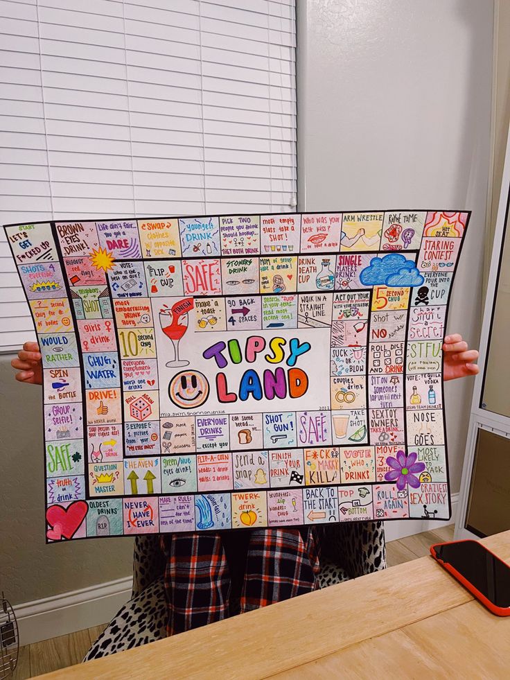 a person holding up a sign that says forest land with lots of words on it