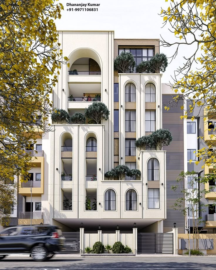 an apartment building with balconies and plants growing on the side of it's windows