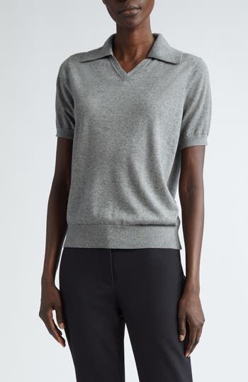 Luxuriously soft cashmere and silk yarns nod to the NYC-based label's focus on impeccable materials in a polo-style sweater topped with a wide johnny collar. 22" length (size medium) Johnny collar Short sleeves Ribbed cuffs and hem 70% cashmere, 30% silk Dry clean Imported Designer Clothing Classic Fitted V-neck Polo Sweater, Fitted Cashmere Polo Sweater In Fine Knit, Fitted Cashmere Polo Sweater With Fine Knit, Fitted Fine Knit Cashmere Polo Sweater, Luxury Fitted Cashmere Tops, Formal Fine Knit Cashmere Tops, Fitted Cashmere Top For Business Casual, Formal Merino Wool Fine Knit Top, Elegant Formal Merino Wool Tops