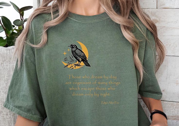 Unleash your literary spirit with our Edgar Allen Poe Literature T-shirt! Perfect for bookworms and English teachers alike, this unique tee celebrates the beauty of literature--a thoughtful gift for any book lover or literary enthusiast. Welcome to OVERRJOY! * Q U I C K * F A C T S * ✺ 100% preshrunk cotton ✺ Wash and dry normally (on cool for best results) * S I Z I N G * ✺ Sizing is relaxed fit - Comfort Colors. ✺ Most women find their typical size works best, since they are meant to fit a tou Literary Style Short Sleeve Screen Print Tops, Screen Print Short Sleeve Tops, Bookish Crew Neck Shirt With Graphic Print, Relaxed Fit Graphic Print Shirt In Bookish Style, Relaxed Fit Graphic Print Shirt With Bookish Style, Literary Graphic Print Crew Neck T-shirt, Literary Cotton Relaxed Fit T-shirt, Literary Style Cotton T-shirt With Relaxed Fit, Literary Crew Neck T-shirt With Screen Print