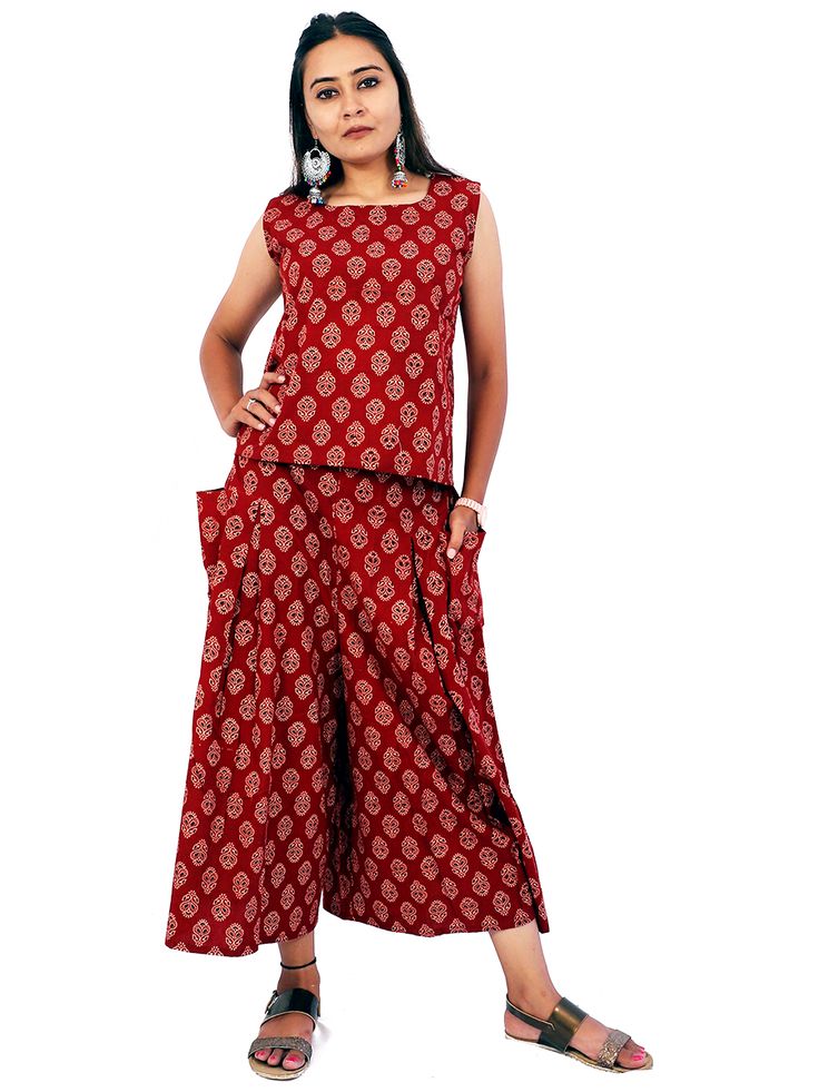 A very beautiful handblock print maroon color sleeveless crop top is paired with broad flared three fourth palazzo which is carrying both side out pockets and back elastic for your comfort. You will definitely feel your attitude keeping your both hands in pockets with your ease. The pure cotton fabric with naturally dyed with vegetable colours only will keep you in cool and light mood for full day. We are offering Plus sizes... Palazzo Crop Top, Hands In Pockets, Pride Of India, Crop Top Set, Sleeveless Crop Top, Maroon Color, Naturally Dyed, Block Print, Pure Cotton