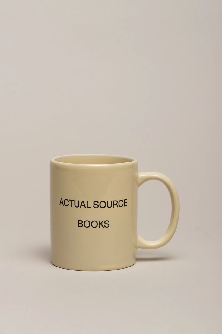 a coffee mug with the words actual source books printed on it