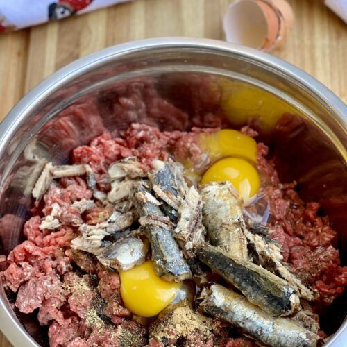 an image of meat and eggs in a pot