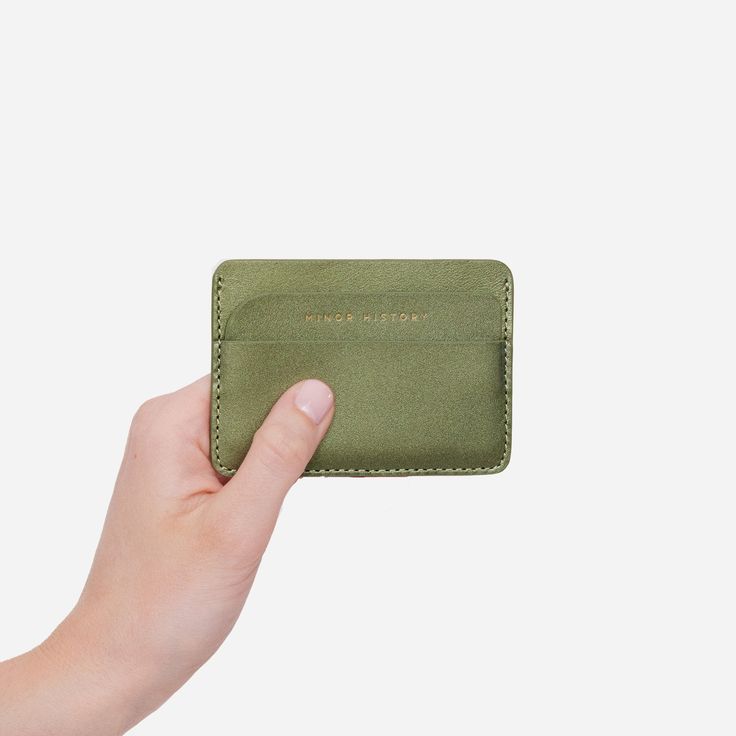 A slim leather card holder inspired by life in the city, rushing between trains and destinations. This smart, no-fuss card case keeps only your most crucial cards close at hand and ready to tap. 3 credit card or ID slots Signature structured leather Dimensions: 3.75" W x 2.625" H Looking for something bigger? Try the Midtown Wallet. Functional Leather Card Holder With Rfid Blocking, Versatile Rectangular Leather Card Holder, Functional Bifold Card Holder With Card Slots, Functional Bifold Card Holder For Everyday Use, Casual Rectangular Card Holder With Rfid Blocking, Green Travel Card Holder With Interior Slots, Modern Card Holder With Id Window For Everyday Use, Casual Rfid Blocking Rectangular Card Holder, Functional Leather Card Holder For Daily Use