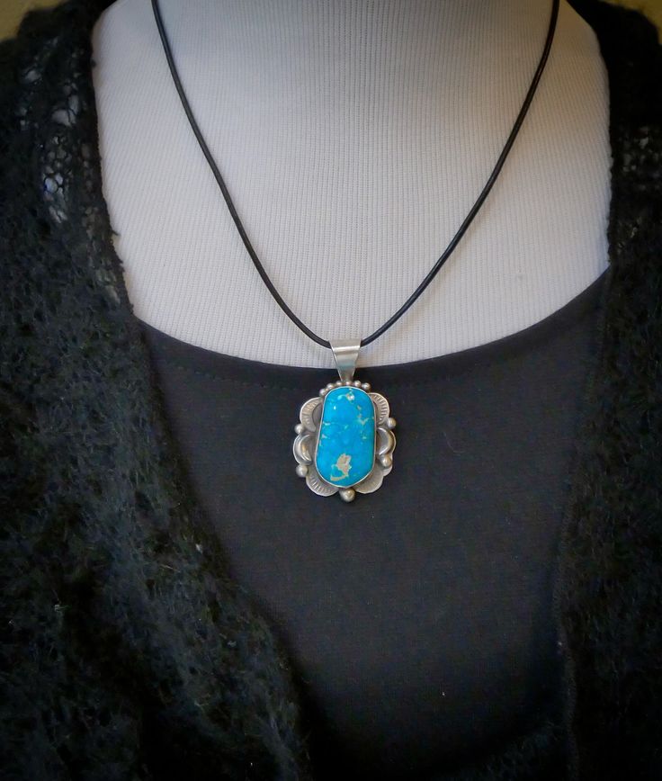 Looking for something extraordinary? This pendant is handcrafted in Sterling Silver and features a breathtaking bright blue Turquoise stone. This is the perfect gift to yourself or someone you love! Measures: 1 3/4 " x 1 1/8" including the bale Bale inside allows for 5 mm or smaller beads or chain Weight: 11 grams Stamped: Sterling Signed: T (Tia Long) Collectible Turquoise Jewelry With Large Stone, Southwestern Style Large Oval Pendant Necklace, Southwestern Pendant Necklace With Large Stone, Southwestern Pendant Jewelry With Large Stone, Turquoise Necklace With Large Oval Pendant, Turquoise Necklace With Large Oval Stone, Turquoise Necklace With Large Oval Stone Pendant, Turquoise Oval Pendant Jewelry Gift, Turquoise Oval Pendant Jewelry As Gift