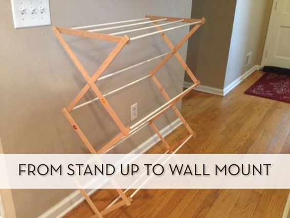 an ironing board leaning against the wall with text that reads, from stand up to wall mount