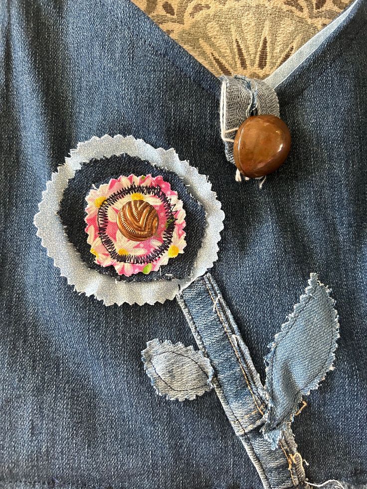 a piece of clothing that has been altered to look like a flower and brooch