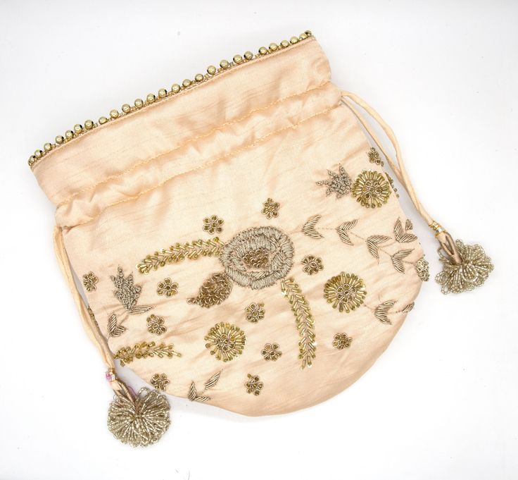 "flower indian artisan zardosi embroidery bag | gold metallic embellish wedding potli bag | golden art deco drawstring wallet purse handbag Package Contents: 1 Size: 8\" x 6\" Designed with the heart, this beautiful Potli or batawa bag are eye catchy and made of premium material. Key Features: Embroidery art work. This potli is good match with both Indian and western outfits and are superb for wedding and festive parties. This would be best complement to your designer saree, lenhga or any other Festive Gold Embroidery Potli Bag, Festive Embroidered Gold Clutch, Gold Festive Clutch For Festivals, Festive Gold Clutch With Zari Work, Gold Bollywood Bag With Handwork, Gold Festive Pouch For Festivals, Bollywood Style Gold Bag With Handwork, Festive Gold Pouch For Festivals, Bollywood Style Gold Festive Bag