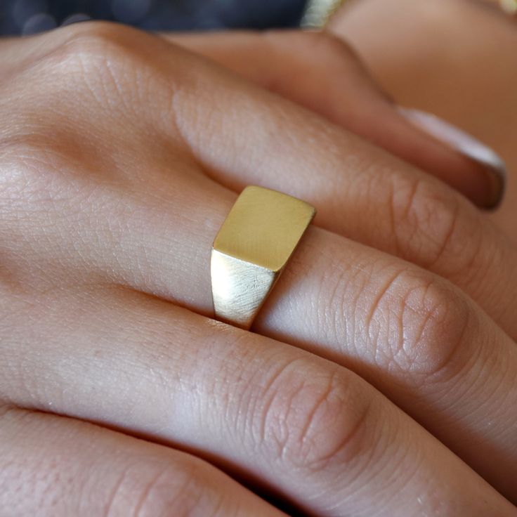 "Classic signet ring made of Matte 14K Gold that looks perfect on the finger. You can order this ring made of rose, yellow or white gold. Options are available when checking out. Given that our jewelry is handmade especially for you, please consider that color variations and slight variances are normal. All items are packaged in an eco-friendly gift wrap ready for gifting. Construction & Dimensions: 14K Gold approximately width 10 mm (0.4\") All our jewelry can be made of 18K gold as well. P Luxury 14k Gold Wide Band Signet Ring, Fine Jewelry Yellow Gold Signet Ring With Thick Band, Modern 14k Gold Signet Ring For Promise, 14k Yellow Gold Wide Band Signet Ring, 14k Gold Tarnish Resistant Signet Ring With Thick Band, Modern Tarnish Resistant Signet Ring For Promise, Minimalist 14k Gold Thick Band Signet Ring, 14k Gold Thick Band Signet Ring For Promise, Thick Band 14k Gold Signet Ring For Promise