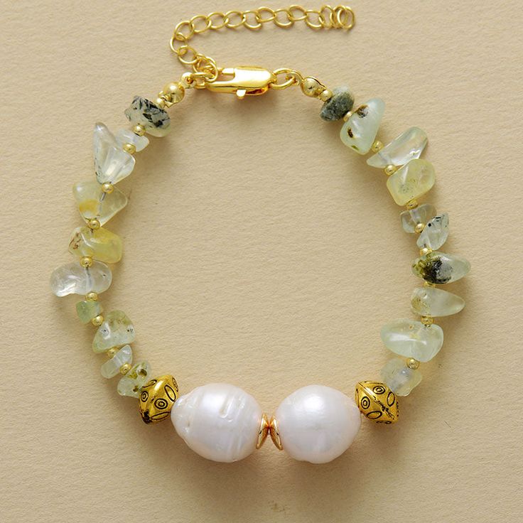 Elevate your style and spirit with the ✨ MantraChakra Baroque Pearl and Prehnite Bracelet ✨. Symbolizing purity, the baroque pearls harmonize with the heart-opening energy of vibrant prehnite stones. Embrace love, balance, and personal growth as you adorn your wrist with this captivating accessory. 💚✨ Materials: Gold Plated, Pearl, Purple Quartz Size: 6.7 -8.7 Inches Spiritual Pearl Bracelet With Pearl Charm As Gift, Spiritual Pearl Bracelet With Charm As Gift, Spiritual Pearl Charm Bracelet As Gift, Pearl Gemstone Bracelets As A Gift, Spiritual Pearl Bracelet Jewelry, Bohemian Gold Pearl Bracelet With Gemstone Beads, Spiritual Beaded Bracelets With Pearl Charm, Gold Bohemian Pearl Bracelet With Gemstone Beads, Adjustable Baroque Pearl Jewelry With Natural Stones